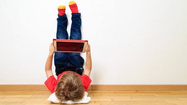 Boy playing on a tablet