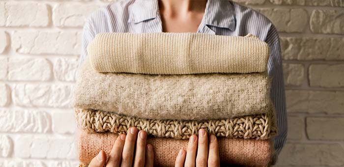 Woman holding clothes