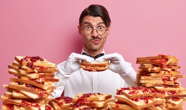 Man eating sandwiches