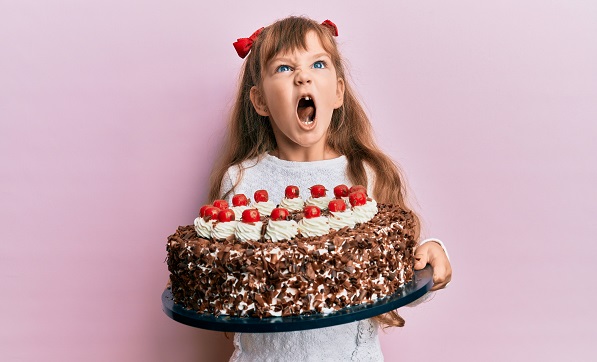 Girl holding cake