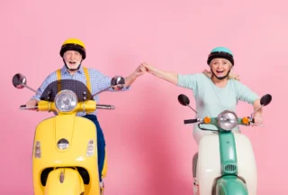 Older Couple on Mopeds
