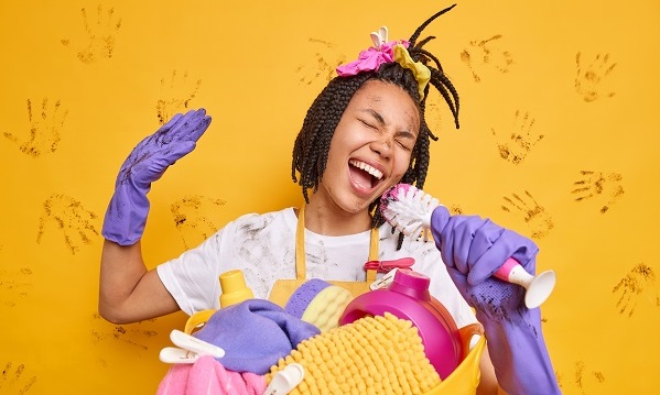 Woman singing and cleaning