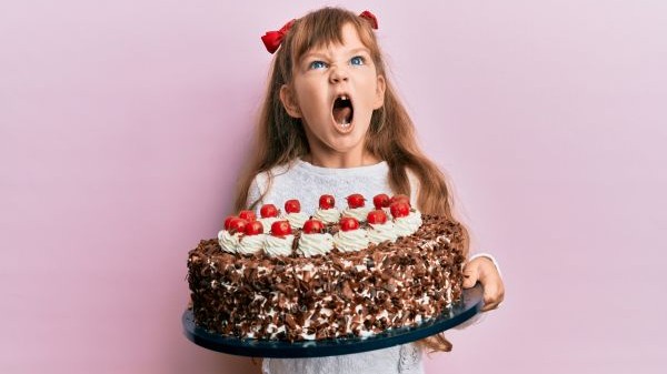 Angry girl with cake